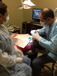 endodontist working on patient's mouth